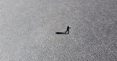 A Researcher surveys the dried-up Lake Akgöl, Van, eastern Türkiye, Aug. 20, 2022. (AA Photo)