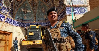 Iraqi rescue workers search for survivors in the rubble following a landslide that hit Qattarat al-Imam Ali shrine on the outskirts of the holy city of Kerbala, Iraq, Aug. 21, 2022. (Reuters Photo)