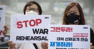 People shout slogans during a protest against South Korea and U.S. military forces' joint Ulchi Freedom Shield (UFS) drill, near the presidential office in Seoul, South Korea, Aug. 22, 2022. (EPA Photo)