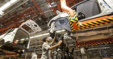 An employee works at the Ford car factory in Izmit, Türkiye, Dec. 17, 2014.