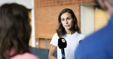 Finland's Prime Minister Sanna Marin speaks with members of the media in Kuopio, Finland, Aug. 18, 2022. (Lehtikuva via Reuters)