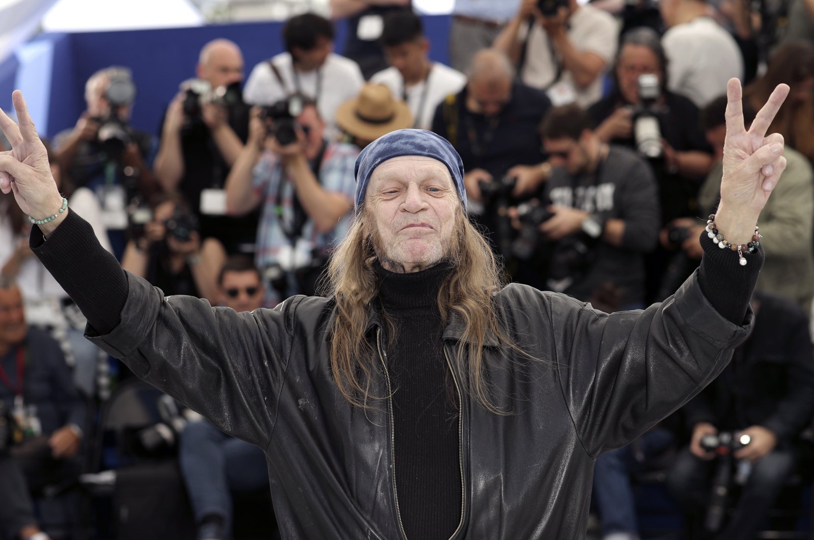 Actor Leon Vitali poses for photographers at the photo call for the film &quot;The Shining&quot; at the 72nd international film festival, Cannes, southern France, May 16, 2019.  (AP Photo)
