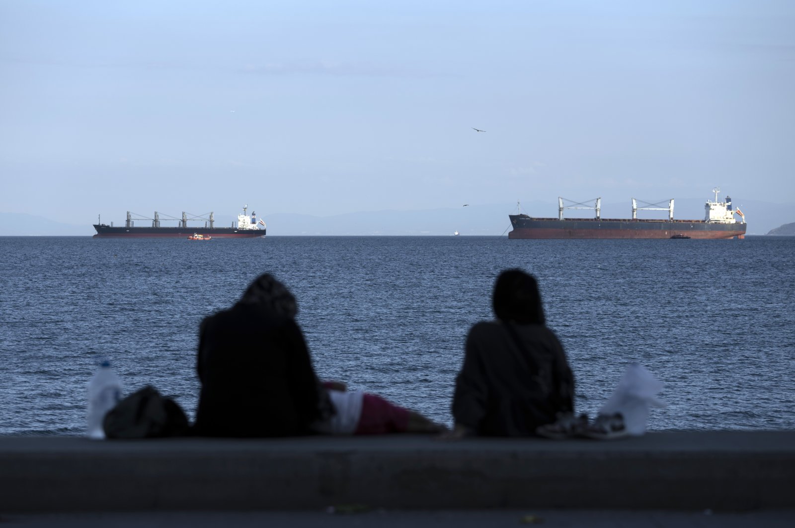 People watch the Marmara Sea, in Istanbul, Türkiye, July 13, 2022. (AP PHOTO)