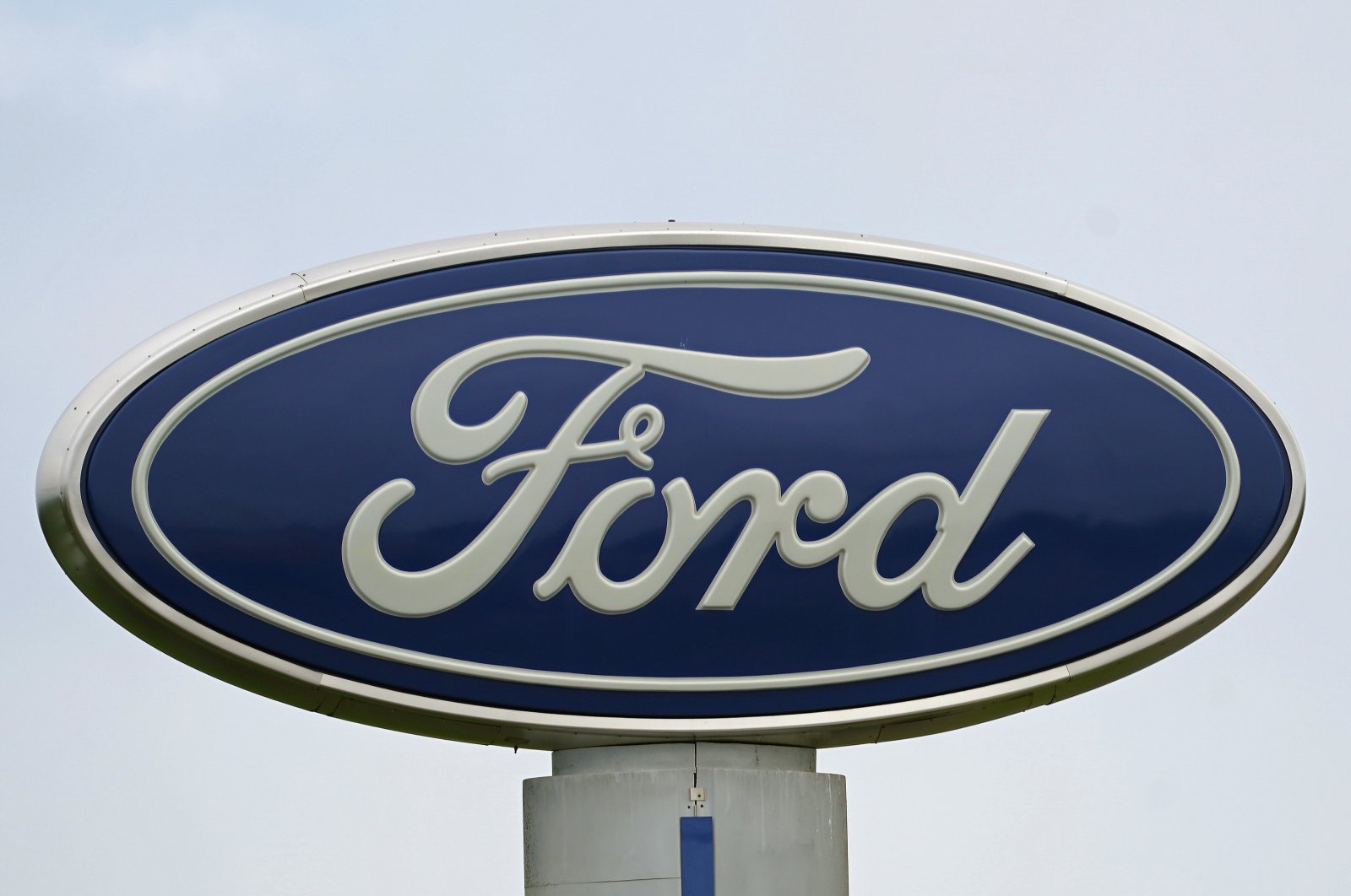 A Ford logo is seen on signage at Country Ford in Graham, North Carolina, U.S., July 27, 2021. (AP Photo)