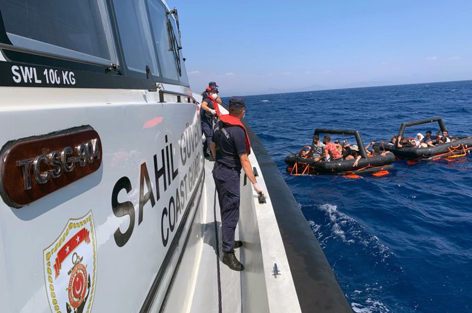 Turkish coast guard units rescue irregular migrants off Marmaris in Muğla province, southwestern Türkiye, Aug. 22, 2022. (IHA Photo)