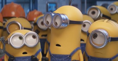 This image released by Universal Pictures shows characters, foreground from left, Bob, Kevin and Stuart in a scene from &quot;Minions: The Rise of Gru.&quot; (AP Photo)