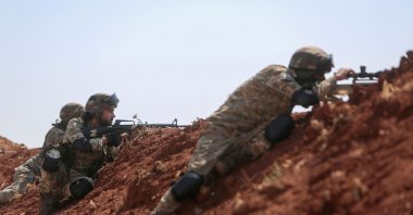 Türkiye-backed Syrian opposition forces are stationed at a position on the outskirts of the town of Marea, in the northern Aleppo countryside, along the frontline with areas held by YPG terrorists, Syria, Aug. 20, 2022. (AFP Photo)