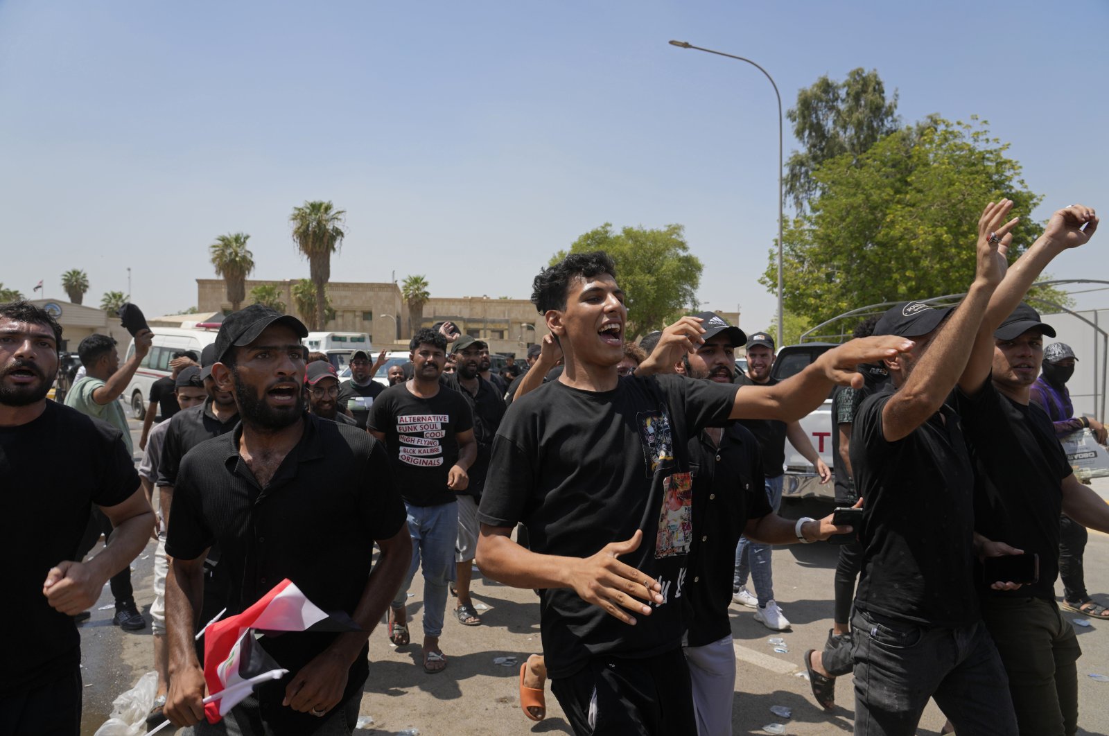 Supporters of Iraqi Shiite cleric Muqtada al-Sadr protest in front the Supreme Judicial Council, in Baghdad, Iraq, Aug. 23, 2022. (AP Photo)