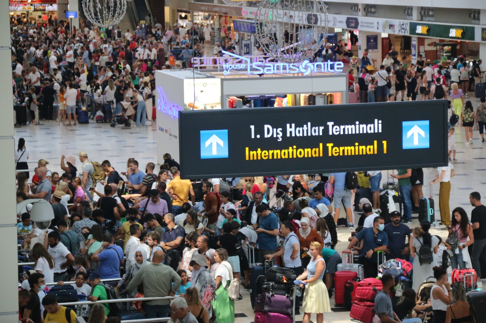 People at the international terminal of Antalya Airport, in Antalya, southern Türkiye, Aug. 11, 2022. (IHA Photo)
