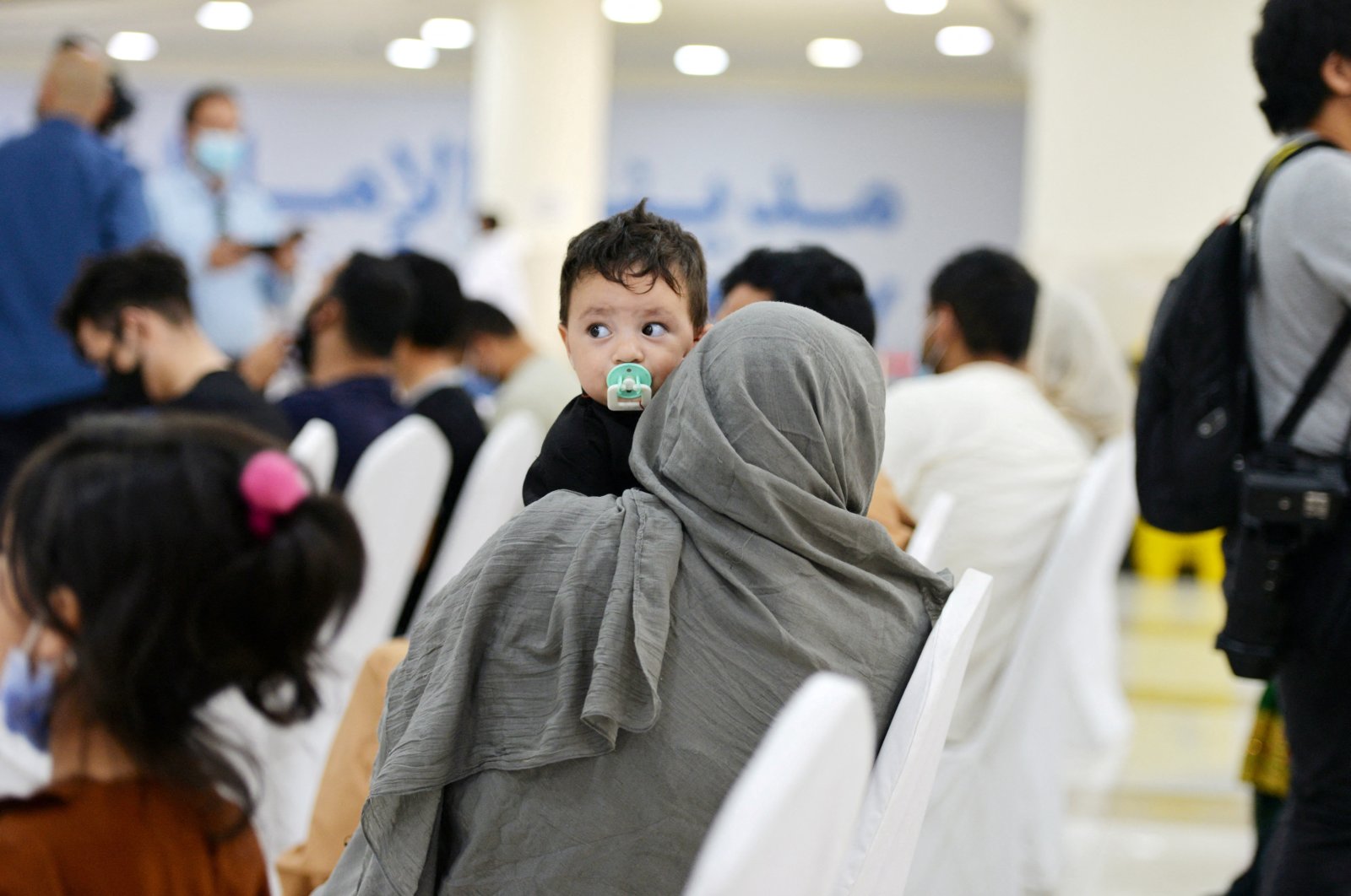 Evacuees from Afghanistan sit at Emirates Humanitarian City in Abu Dhabi, UAE, Aug. 28, 2021. (Reuters Photo)