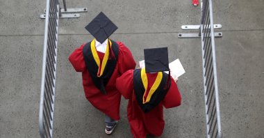 New graduates walk into the High Point Solutions Stadium before the start of the Rutgers University graduation ceremony in Piscataway Township, New Jersey, May 13, 2018. (AP Photo)