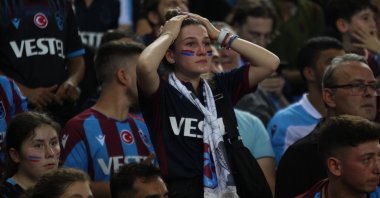 A Trabzonspor fans reacts after the Champions League playoff against Copenhagen, Trabzon, Türkiye, Aug. 24, 2022. (IHA Photo)