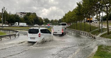 Cars drive on a flooded road, in Istanbul, Türkiye, Aug. 25, 2022. (AA PHOTO) 