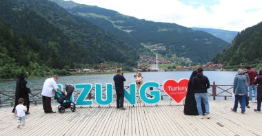 Locals and tourists enjoy the view at Uzungöl, a lake situated to the south of the city of Trabzon, northern Türkiye, Aug. 25, 2022. (IHA Photo)
