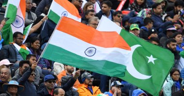 Spectators wave India and Pakistan's flags in Manchester, England, June 16, 2019. (AFP Photo)