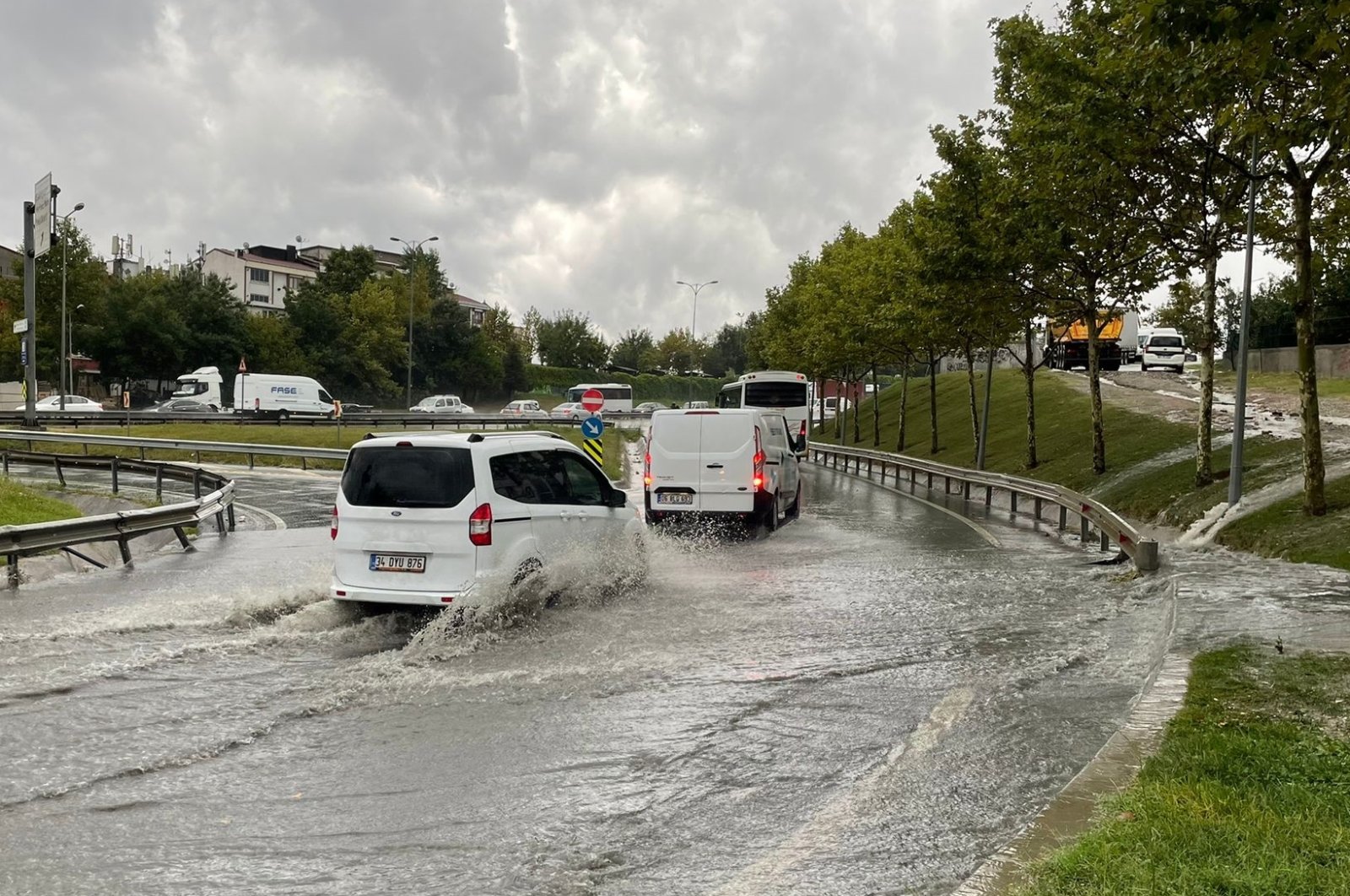 Cars drive on a flooded road, in Istanbul, Türkiye, Aug. 25, 2022. (AA PHOTO) 