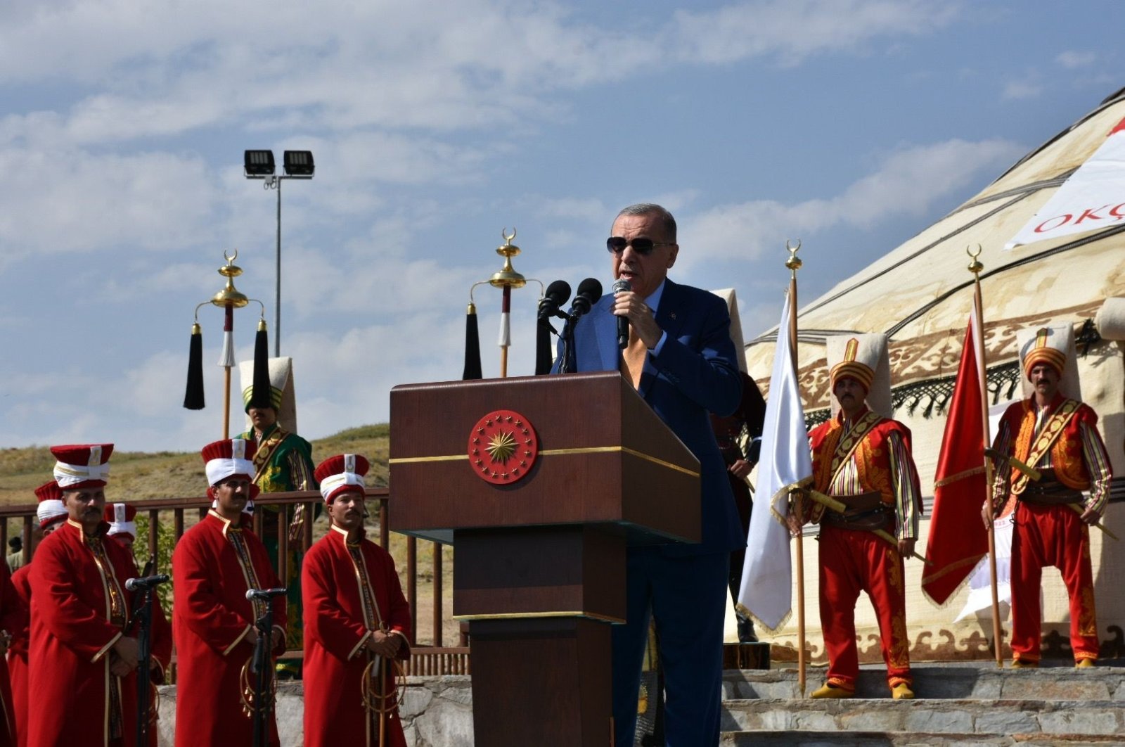 President Recep Tayyip Erdoğan speaks against the backdrop of an Ottoman mehter band, in Ahlat, Bitlis, southeastern Türkiye, Aug. 25, 2022. (İHA PHOTO)