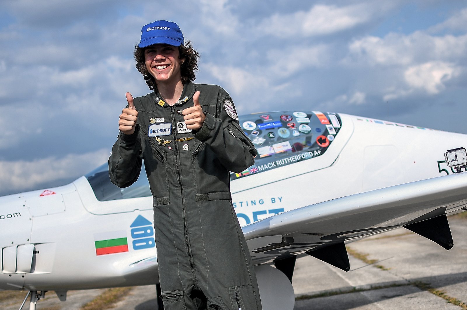 The 17-year-old Mack Rutherford posing for a picture after landing his airplane successfully at Skydive West Airport of Sofia, Bulgaria, Aug. 24, 2022. (EPA Photo)