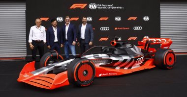 Formula One, FIA and Audi executives pose with new F1 Audi car, in Spa-Francorchamps, Belgium, Aug. 26, 2022. (REUTERS PHOTO) 