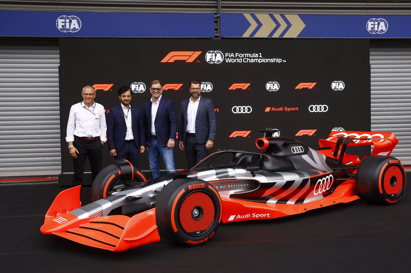 Formula One, FIA and Audi executives pose with new F1 Audi car, in Spa-Francorchamps, Belgium, Aug. 26, 2022. (REUTERS PHOTO) 