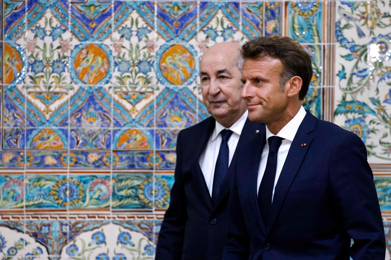 French President Emmanuel Macron (R) and Algeria&#039;s President Abdelmadjid Tebboune (L) leave at the end of a joint press conference at the presidential palace in Algiers, Algeria, Aug. 25, 2022. (AFP Photo)