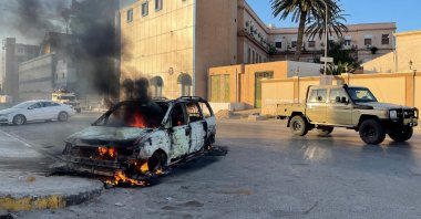 Fighters loyal to the Government of National Unity are pictured in the street in the Libyan capital Tripoli, Aug. 27, 2022, following clashes between rival Libyan groups. (AFP)