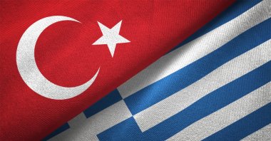 Turkish and Greek flags are seen in a textile cloth fabric texture, Sept. 6, 2020. (Getty Images)