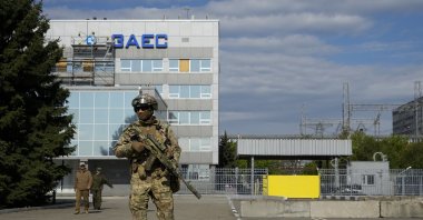 A Russian soldier stands guard in an area of the Zaporizhzhia Nuclear Power Station, southeastern Ukraine, May 1, 2022. (AP Photo)