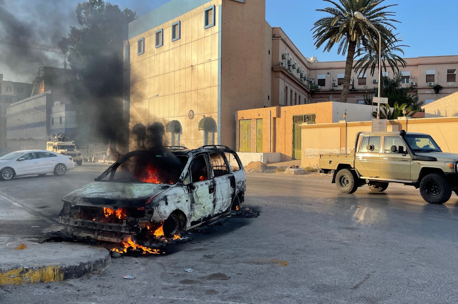 Fighters loyal to the Government of National Unity are pictured in the street in the Libyan capital Tripoli, Aug. 27, 2022, following clashes between rival Libyan groups. (AFP)