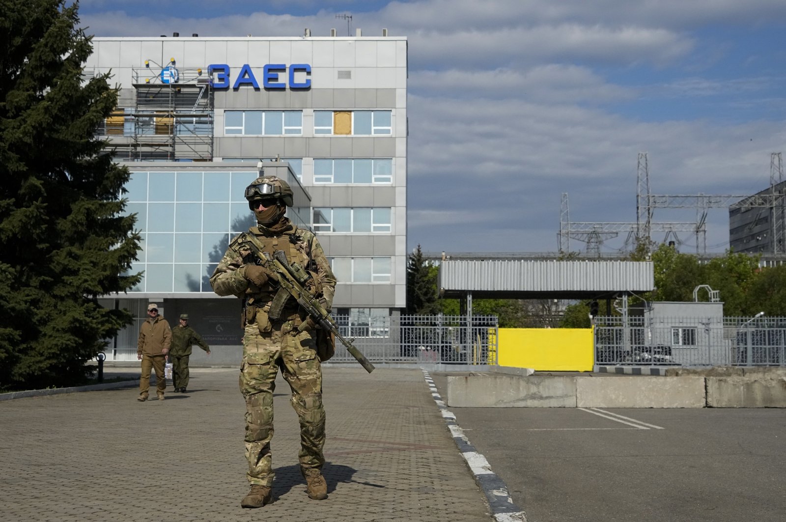 A Russian soldier stands guard in an area of the Zaporizhzhia Nuclear Power Station, southeastern Ukraine, May 1, 2022. (AP Photo)