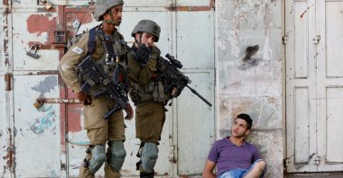 Israeli army soldiers detain a Palestinian during their clash with Palestinians in Hebron, the Israeli-occupied West Bank, Palestine, Aug. 26, 2022. (Reuters Photo)