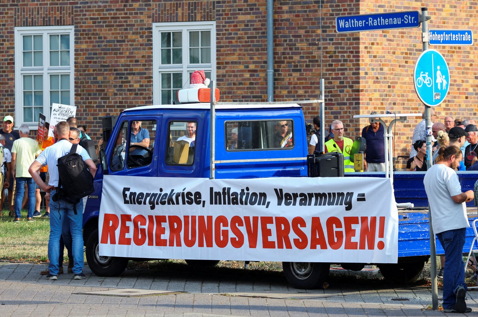 A banner reading &quot;energy crisis, inflation, impoverishment = government failure&quot; is put on a vehicle as people protest while German Chancellor Olaf Scholz visits a research laboratory at Magdeburg University, in Magdeburg, Germany, Aug. 25, 2022. (Reuters Photo)