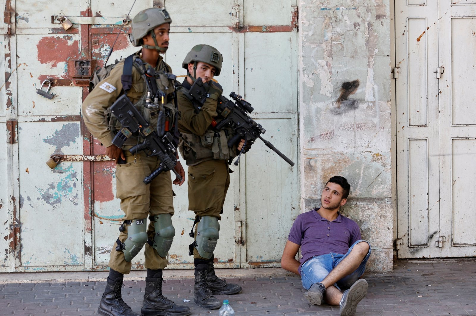 Israeli army soldiers detain a Palestinian during their clash with Palestinians in Hebron, the Israeli-occupied West Bank, Palestine, Aug. 26, 2022. (Reuters Photo)
