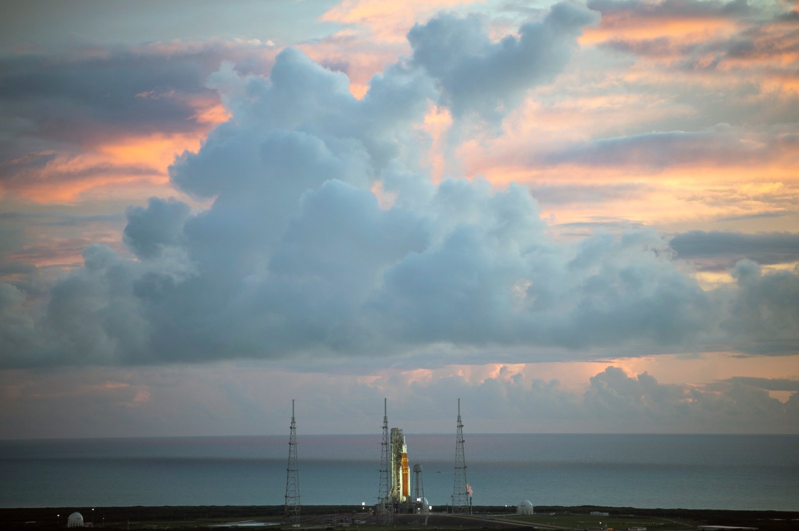 The NASA moon rocket stands ready at sunrise on Pad 39B before the Artemis 1 mission to orbit the moon at the Kennedy Space Center, in Cape Canaveral, Florida, U.S., Aug. 29, 2022. (AP Photo)