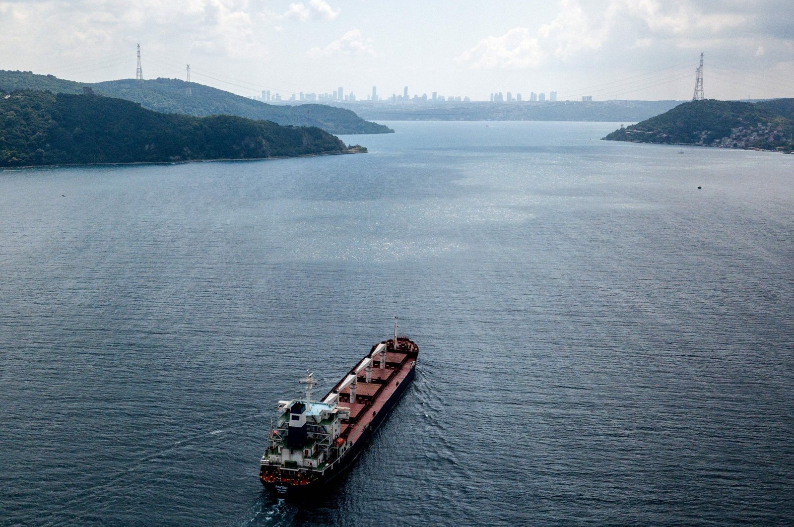 An aerial view shows the Sierra Leone-flagged cargo vessel Razoni sailing en route to Tripoli, Lebanon, along the Bosphorus Strait, Istanbul, Türkiye, Aug. 3, 2022. (AFP Photo)