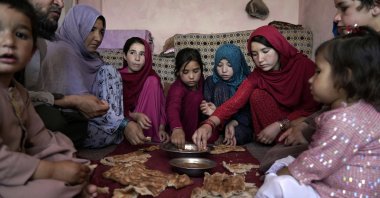 A family eat lunch in their home in one of Kabul's poor neighborhoods in Kabul, Afghanistan, May 21, 2022.(AP Photo)