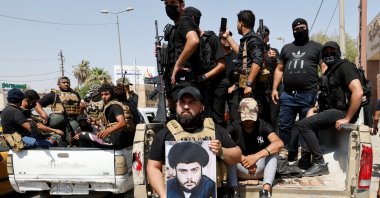 Followers of Iraqi cleric Moqtada al-Sadr withdraw from the streets after violent clashes, near the Green Zone in Baghdad, Iraq, Aug. 30, 2022. (Reuters Photo)
