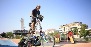 Alex Sidney rides his &quot;tall bike,&quot; in Kırklareli, northwestern Türkiye, Aug. 30, 2022. (AA PHOTO) 