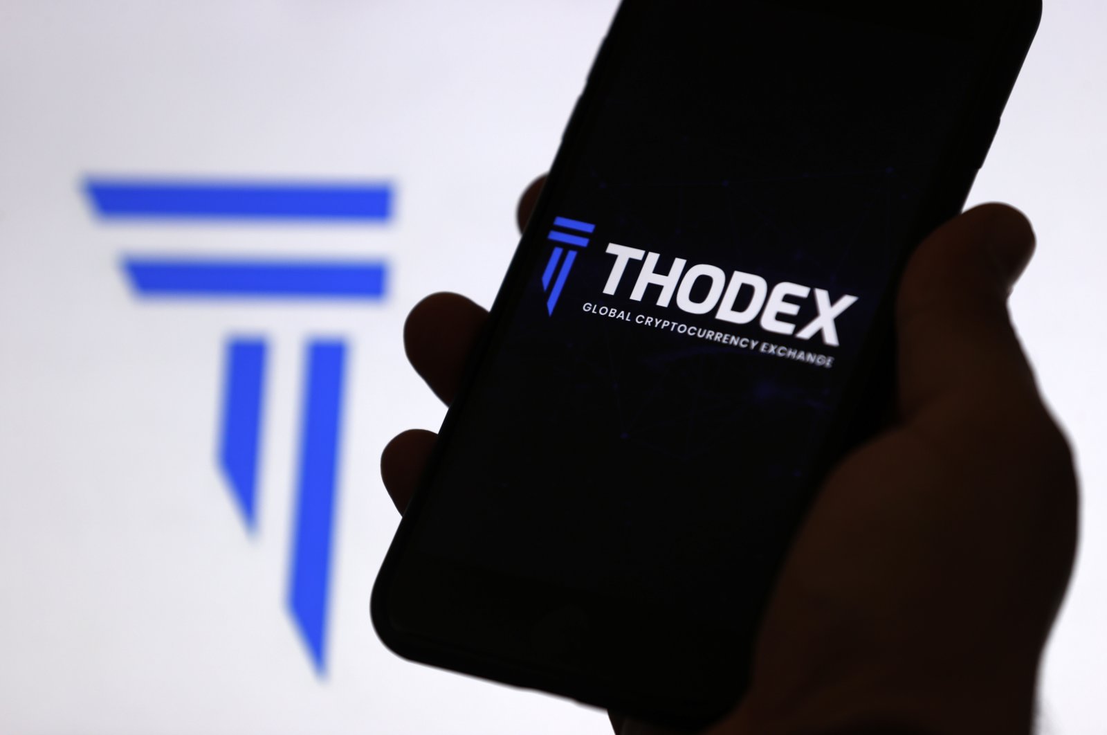 The Thodex cryptocurrency exchange logo is displayed on a mobile phone screen, April 22, 2021. (AA Photo)