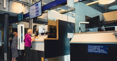 Russian tourists having their passports checked at the Nuijamaa border crossing, Finland, July 28, 2022. (AFP Photo)