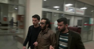 Security officers escort Mohammed al-Rasheed after his detention in Şanlıurfa, March 15, 2015. (A HABER PHOTO)