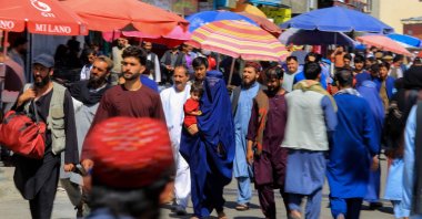 An Afghan woman walks on a road in Kabul, Afghanistan, Aug. 11, 2022. (EPA Photo)