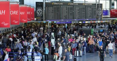 People wait in line before check-in counters during a Lufthansa pilots strike, at the international airport in Frankfurt am Main, Germany, Sept. 2, 2022. (EPA Photo)