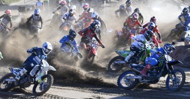Riders compete during the start of the MXGP qualification race in Hyvinka, Finland, Aug 13, 2022. (AFP Photo)