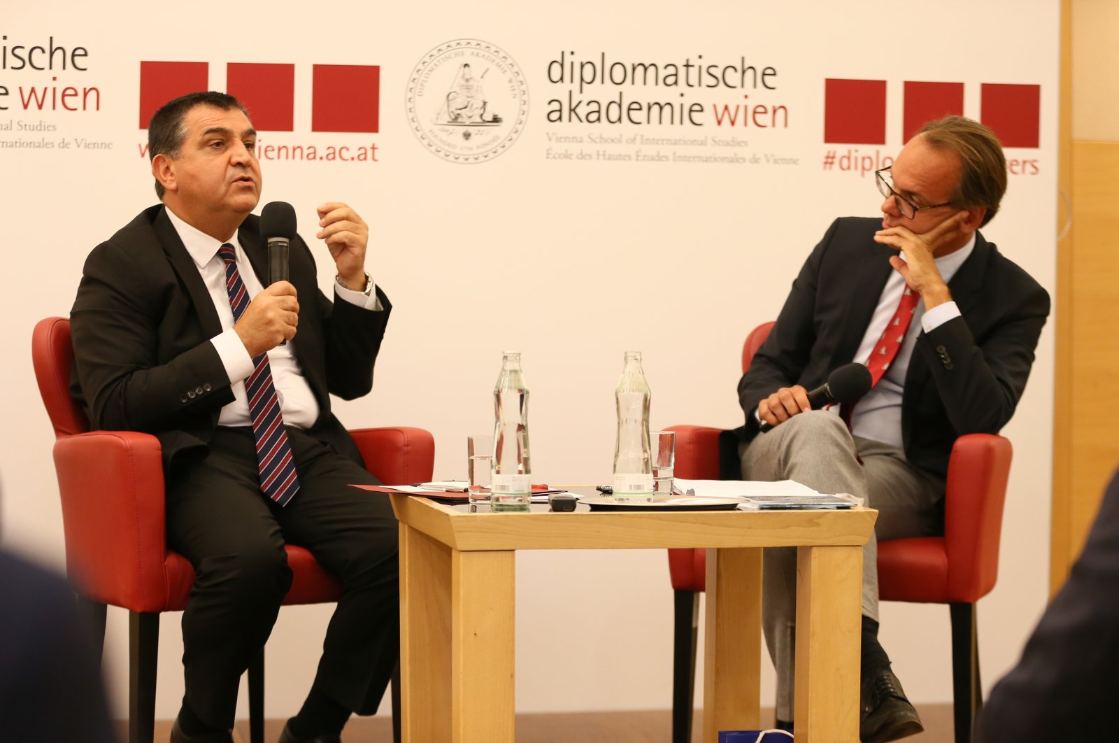 Deputy Foreign Minister Faruk Kaymakcı (L) addresses the Vienna Diplomacy Academy, Austria, Sept. 2, 2022. (AA Photo)