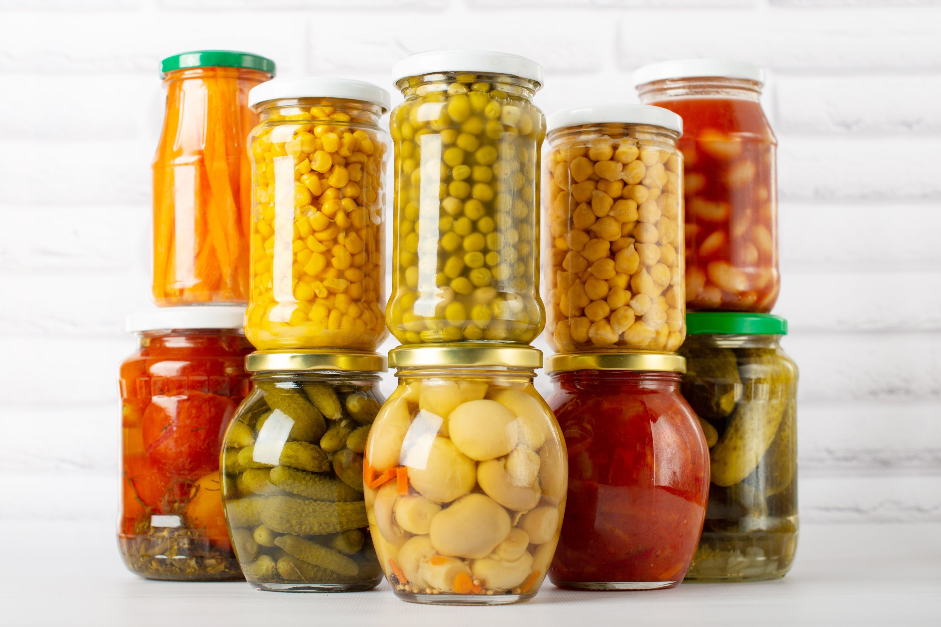 Different types of canned vegetables in glass jars.  (Shutterstock) 