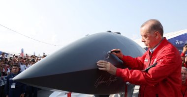 President Recep Tayyip Erdoğan signs a Bayraktar Kızılelma at the Teknofest Black Sea in Samsun, Türkiye, Sept. 3, 2022. (Reuters Photo)
