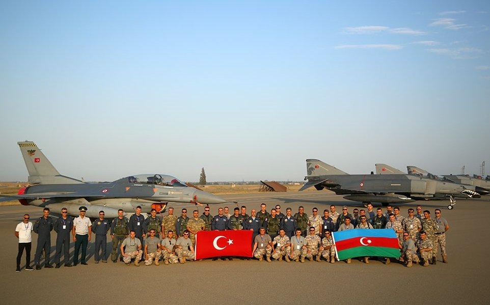 Members of the Turkish and Azerbaijani air forces pose for a picture ahead of the TurAz Qartalı 2022 drill in Azerbaijan, Monday, Sept. 5, 2022. (AA Photo)