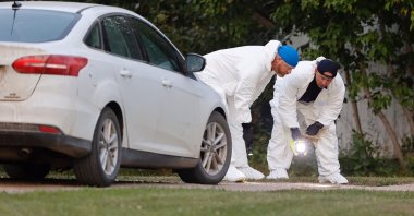 A police forensics team investigates a crime scene after multiple people were killed and injured in a stabbing spree in Weldon, Saskatchewan, Canada, Sept. 4, 2022. (Reuters Photo)