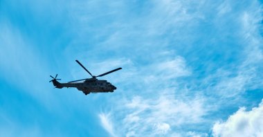 A Turkish Sikorsky helicopter flies over İzmir, western Türkiye, June 1, 2021. (Shutterstock Photo)